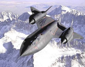Lockheed SR-71 Blackbird flying above the mountains